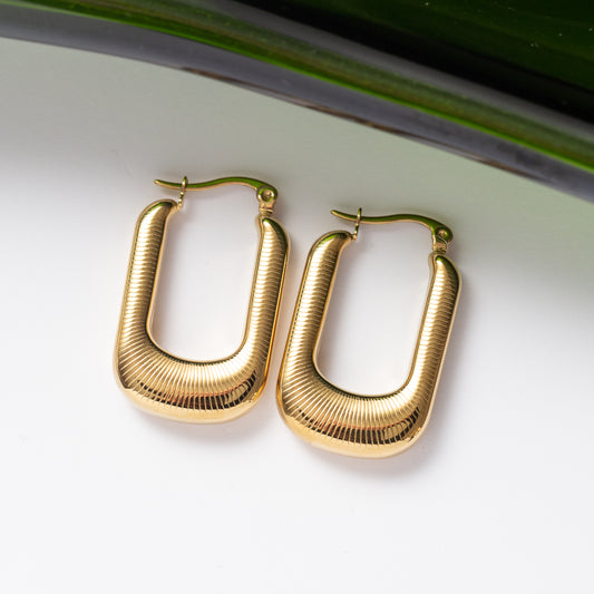 Boucles d'oreilles Pureté dorée 2 en acier inoxydable garanties