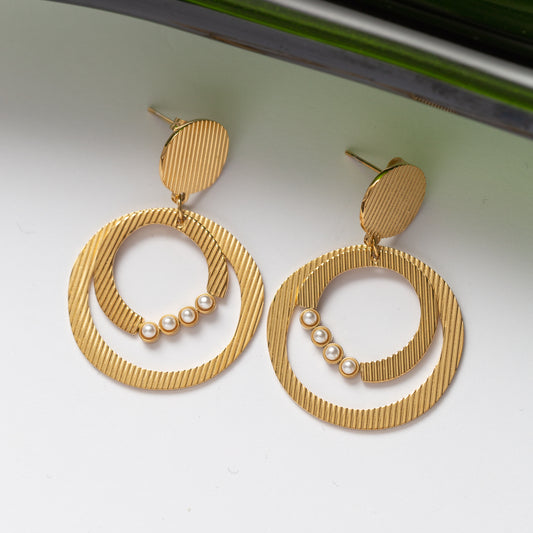 Boucles d'oreilles Pureté dorée 2 en acier inoxydable garanties