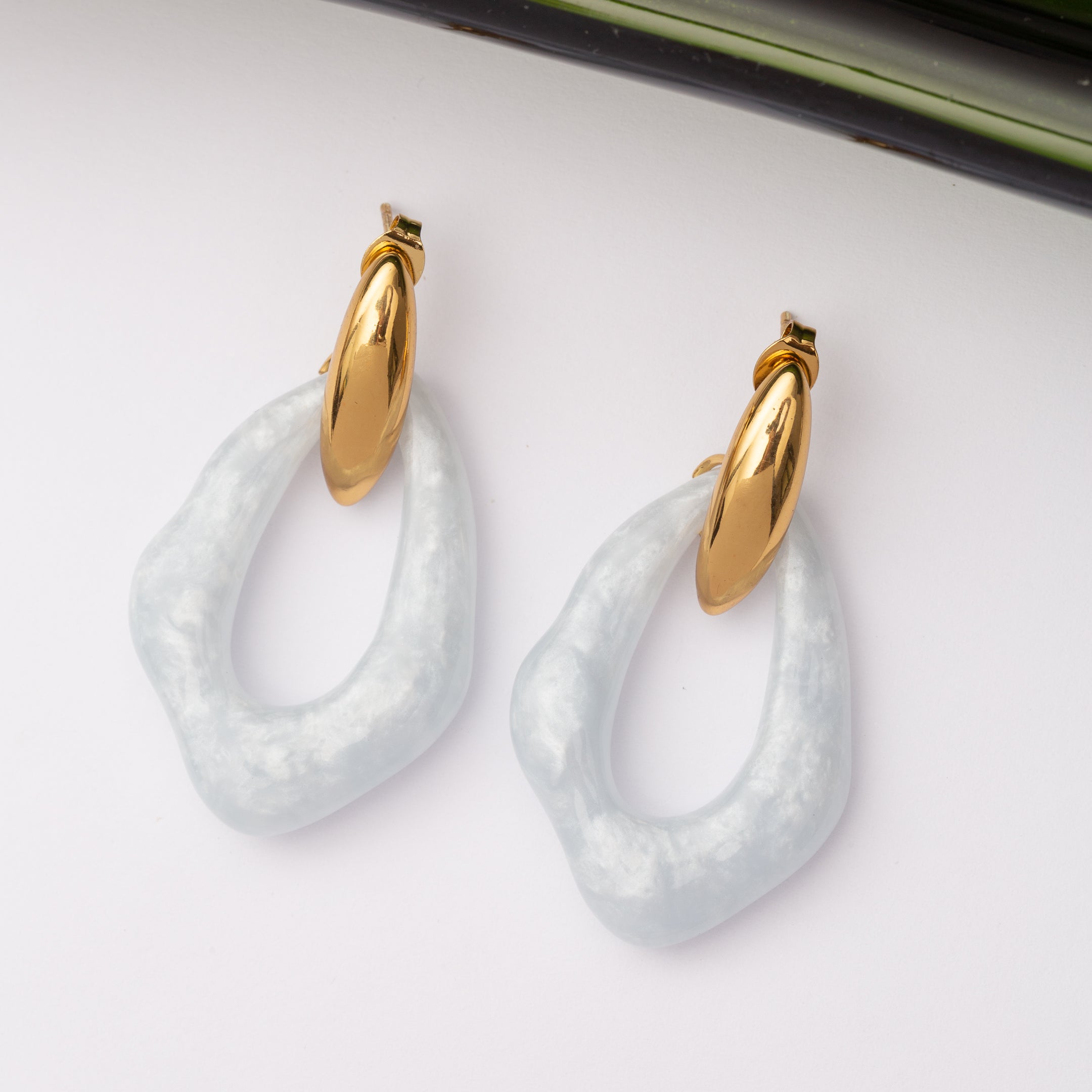 Boucles d'oreilles Monogramme en acier inoxydable garanties