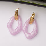 Boucles d'oreilles Monogramme en acier inoxydable garanties