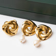 Ensemble Acier Tendance. Bague et une paire de boucles d'oreilles